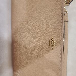 Coach tan wristlet wallet